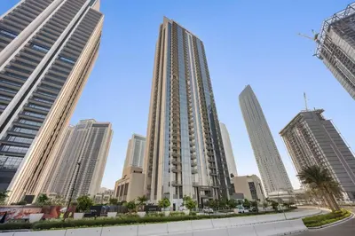 a tall building in the middle of a city at StoneTree - Elegant 1BR in amazing community in Dubai