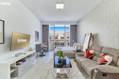 a living room with a couch and a tv at bnbmehomes - Luma21 in Dubai