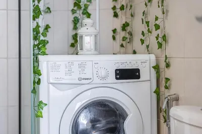 a washing machine with a light on top of it at Cozy Haven with Spiritual Charm in JLT in Dubai