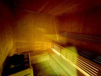 a sauna with a bench in a wooden room at New 1 bedroom with Canal View - Close to Downtown in Dubai