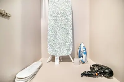 a bathroom with a toilet and a shower curtain at StoneTree - Furnished 2 BR with City View in Dubai