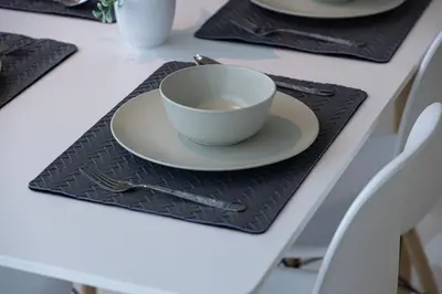 a white cup on a plate on a table at DIFC Luxurious Spacious 1-Bed Apt in a Prime Location in Dubai