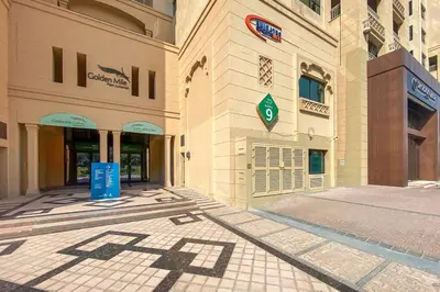 an empty street in front of a building at StoneTree - Luxurious 1 BR with Beach Access at Fairmont The Palm in Dubai