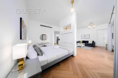 a bedroom with a bed and a living room at Jumeirah Beach Residence - Rimal 4, Dubai Marina in Dubai