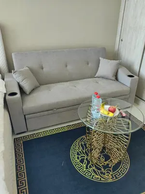 a living room with a couch and a glass table at 7 Palm Jumeirah in Dubai