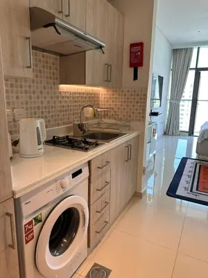 a kitchen with a washing machine and a sink at 7 Palm Jumeirah in Dubai