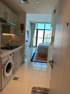 a kitchen with a washer and dryer in a room at 7 Palm Jumeirah in Dubai