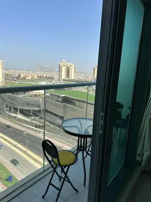 a balcony with a table and two chairs and a window at 7 Palm Jumeirah in Dubai