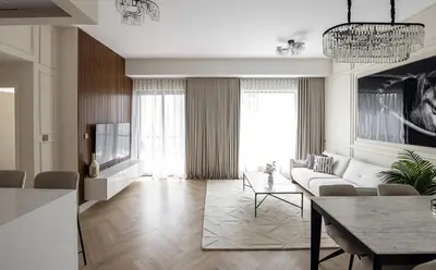 a living room with a couch and a table at Beautiful stylish 1 bedroom by the JBR beach ! in Dubai