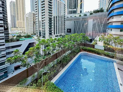 a swimming pool on the roof of a building at Trophy - Private Office Solace Suite in Dubai