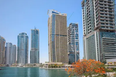 a city with tall buildings and a body of water at StoneTree - Furnished Studio Near Metro in Dubai