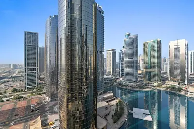 a view of a large city with tall buildings at StoneTree - Elegant 1 BR with Amazing View in Dubai
