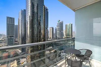 a balcony with a view of a city at StoneTree - Elegant 1 BR with Amazing View in Dubai