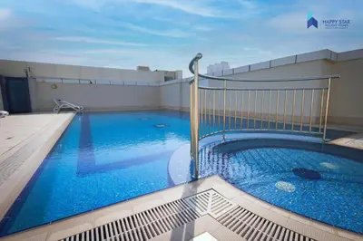 a swimming pool on the roof of a building at Stylish 2BR Suite Near MOE in Dubai