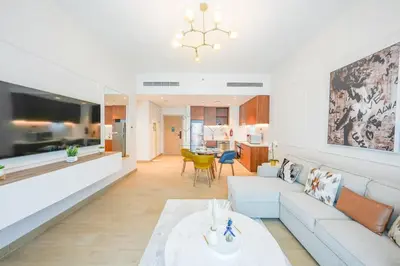a living room with a couch and a table at Yogi - Luxury Apartment With Sea View Close to the Beach in Dubai