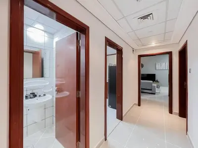 a bathroom with a sink and a mirror at StoneTree - Modern 1 BR Apartment Near The Beach in Dubai