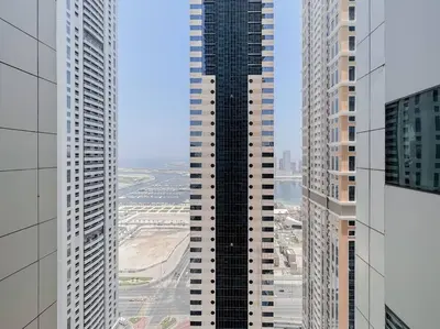 an aerial view of a tall building in a city at StoneTree - Modern 1 BR Apartment Near The Beach in Dubai