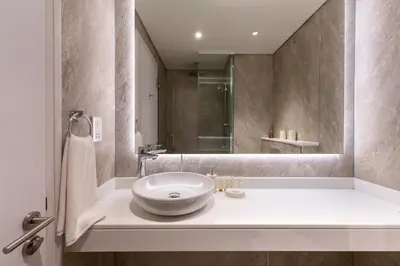a bathroom with a sink and a mirror at Seven Palm, Palm Jumeirah - Mint Stay in Dubai