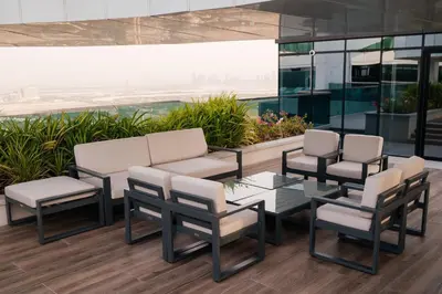 a group of chairs and a table on a building at 2BR 1 Residences Zabeel with Sleeps 5 - Luxury Stay in Dubai