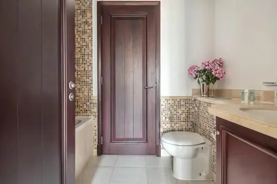 a bathroom with a toilet and a sink at Frank Porter - Reehan 1 in Dubai