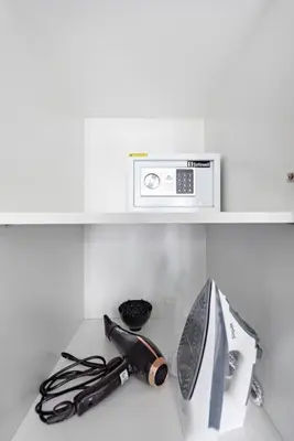 a microwave sitting on top of a kitchen counter at StoneTree - NEW Furnished 1BR in V3 Tower in Dubai