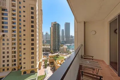 a balcony with a view of the city at Sleek Studio in JBR with Pool & Dubai Skyline View in Dubai