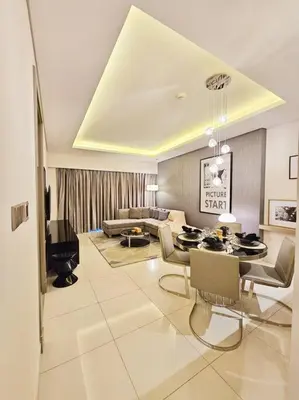 a living room with a couch and a table at Luxury Paramount Hotel Apt D635 in Dubai