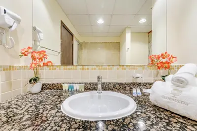 a bathroom with a sink and a mirror at GlobalStay 3 Bedroom Apartment near JBR Beach Dubai Marina in Dubai