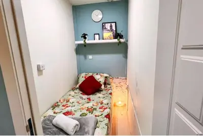 a small room with a bed in a small room at Small Private Partition Room in Al Barsha 1 Near Metro in Dubai