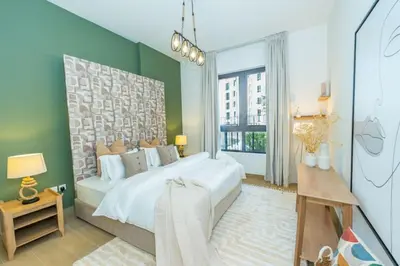 a bedroom with a large bed and a large window at Azure Escape !Joyful 1 Bed Apartment close to the Sea! in Dubai