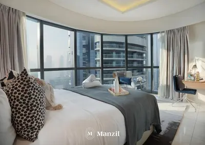 a bedroom with a large bed with a large window at Manzil - Stunning 3BR Apt in Paramount nr Burj in Dubai