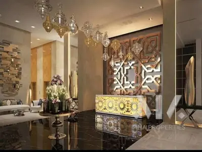 a living room with a chandelier and a lobby at Ghalia Damac Studio Apartment in Dubai