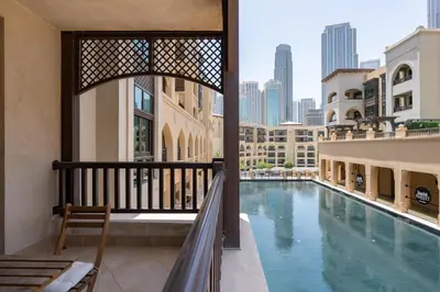 a view from the balcony of a building with a swimming pool at Lux BnB I Souk Al Bahar I Burj Khalifa Views in Dubai