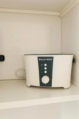 a microwave sitting on top of a counter at Stylish Studio For Two in Dubai