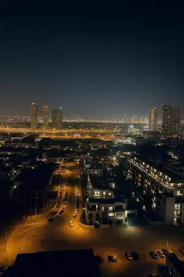 a view of a city at night with buildings at Stylish Studio For Two in Dubai