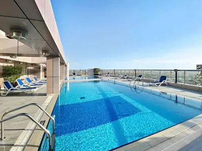 a swimming pool on the top of a building at StoneTree - Sit Back, Relax and Your New View Awaits in Dubai