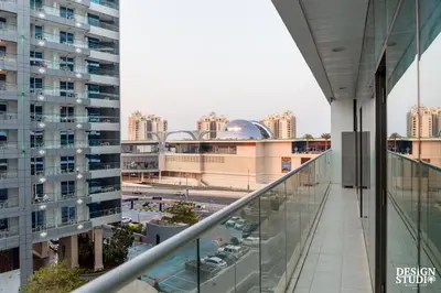 a view of the city from the balcony of a building at SEVEN PALM by Design Studio 2BR in Dubai