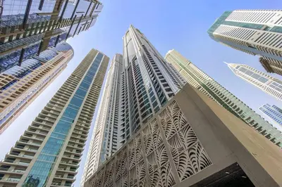 a group of tall buildings looking up into the sky at StoneTree - Elegant 1BR in Famous Location in Dubai