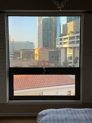a bedroom window with a view of a city at Upscale 3br in JBR next to Ritz-Carlton in Dubai