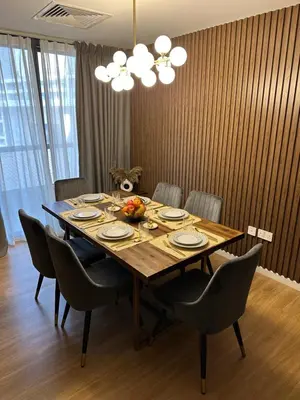 a dining room table with chairs and a table at Upscale 3br in JBR next to Ritz-Carlton in Dubai