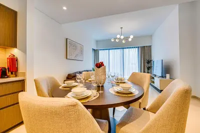 a dining room with a table and chairs at Stunning 2 bedroom apartment near Burj Khalifa in Dubai