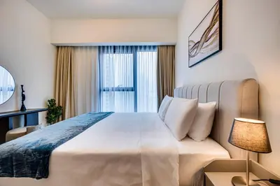 a bedroom with a large bed and a window at Stunning 2 bedroom apartment near Burj Khalifa in Dubai
