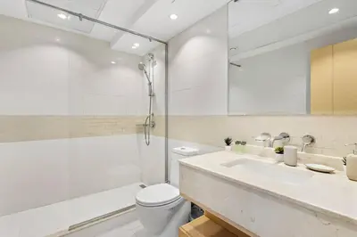 a bathroom with a toilet and a sink and a shower at StoneTree - Stylish fully-furnished 1 BR in Dubai