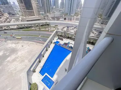a view of a swimming pool from a building at StoneTree - Amazing View - Modern 1BR in Dubai