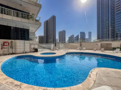 a large swimming pool on top of a building at Cozy Heaven with full Marina View in Dubai