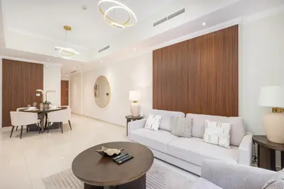 a living room with a couch and a table at Heaven Crest Vacation Homes Downtown - Studio and 1 Bedroom Suites 2 minute walk to Dubai Mall and Burj Khalifa in Dubai