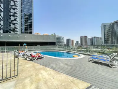 a swimming pool on the roof of a building at Heaven Crest Vacation Homes Downtown - Studio and 1 Bedroom Suites 2 minute walk to Dubai Mall and Burj Khalifa in Dubai