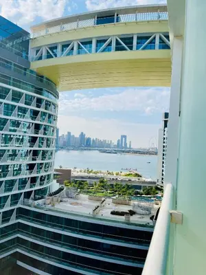 a view of the city from the balcony of a building at Dream Inn - Seven Palm - Free Beach Access in Dubai