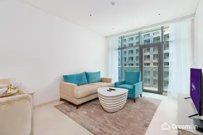 a living room with a couch and two chairs at Dream Inn - Seven Palm - Free Beach Access in Dubai