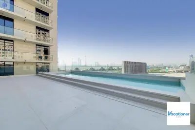 a view from the top of a building with a swimming pool at O Ten, Al Jaddaf - Neat Studio in Dubai